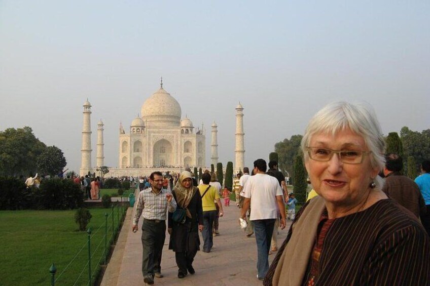 The Taj Mahal with visitors walking in the foreground. 5