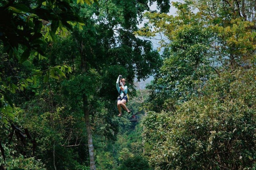 A person jumping in a forest. 1