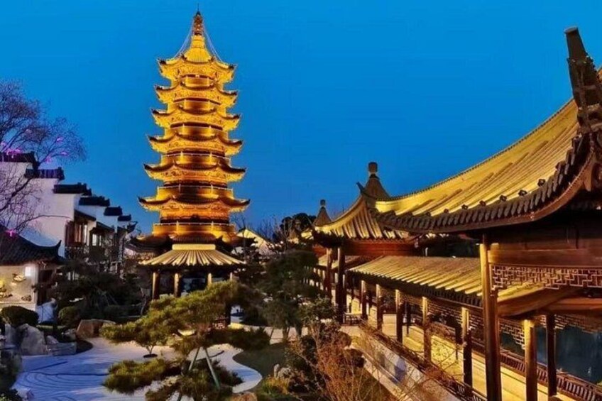 As the sun sets, the charming historic buildings and dazzling lights come together in a magical scene. 4