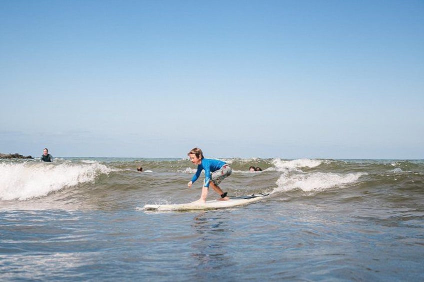 A person surfing on a wave in the ocean. 5