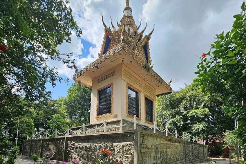 A traditional Thai temple with ornate architecture, surrounded by lush greenery. 3