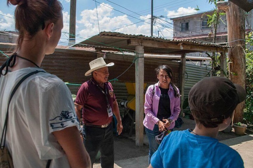 Interpreter and coffee producer introduction at a local house 2