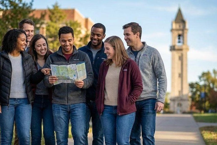 A group of people standing outdoors, one holding a map. 1
