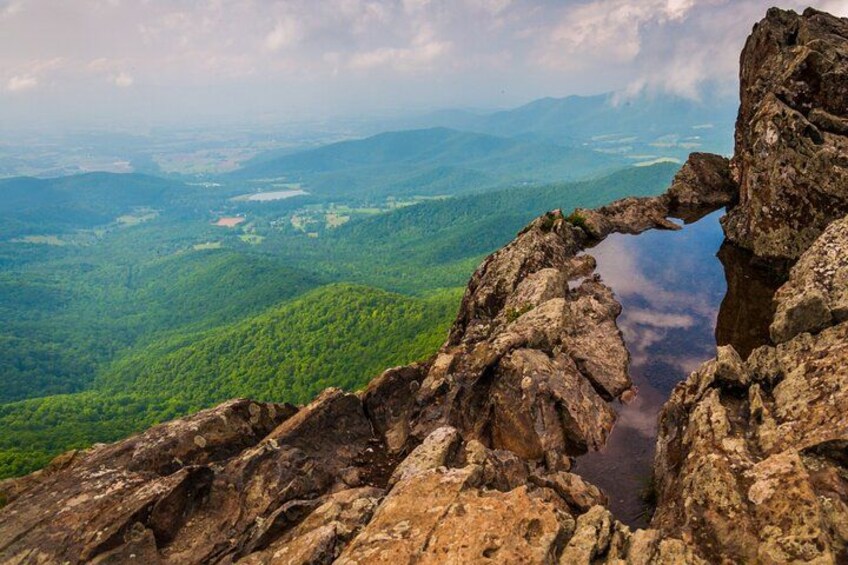 A rocky landscape with a natural arch formation. 5
