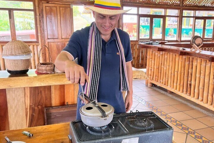 A person cooking on a stove in a rustic kitchen setting. 5