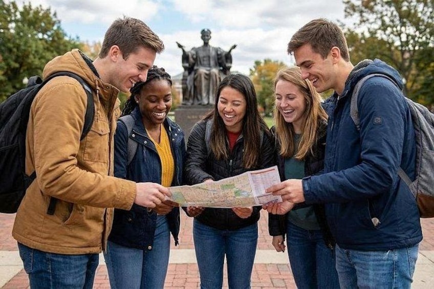 A group of people examining a map outdoors. 1