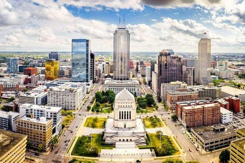 A cityscape with a prominent government building, several high-rise buildings, and a mix of commercial and residential structures. 3