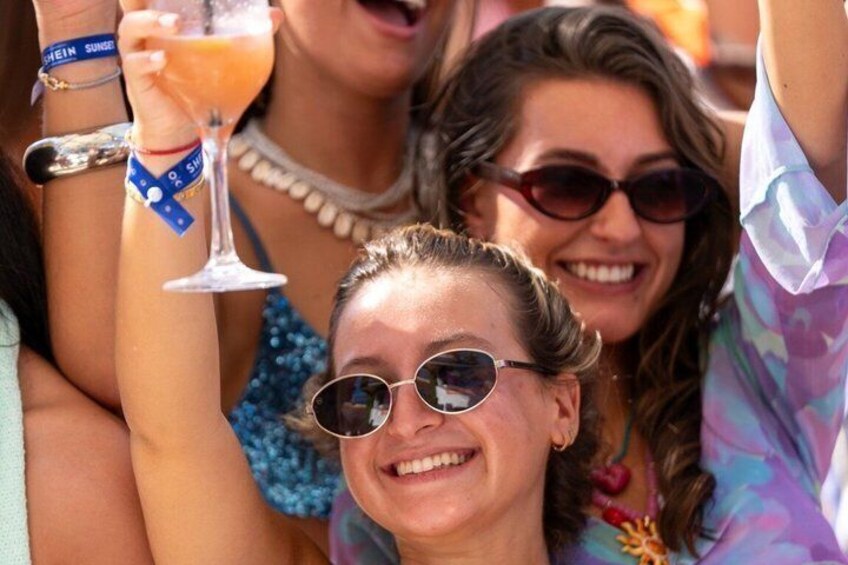 People holding drinks, wearing sunglasses, and wearing bracelets. 3