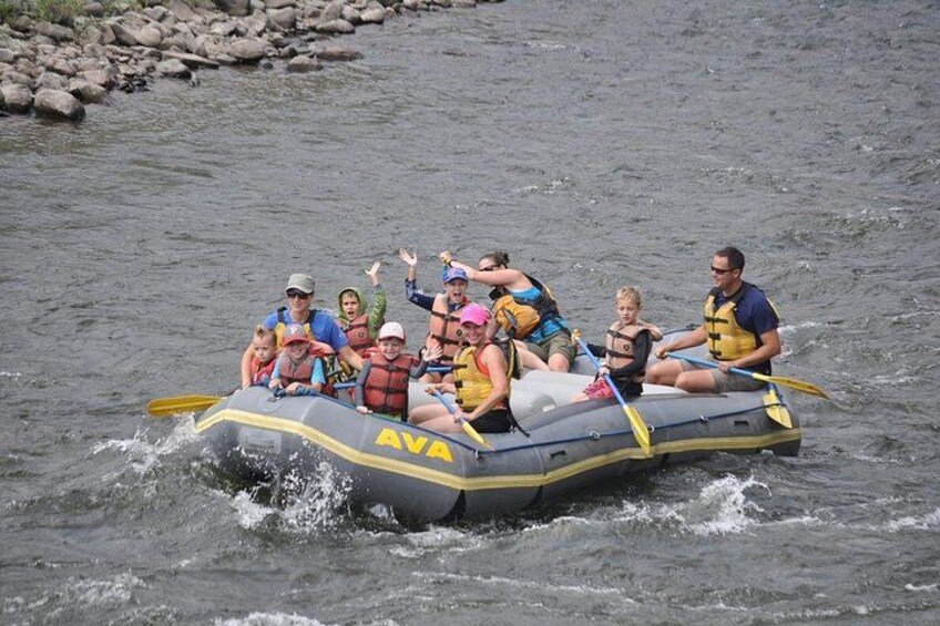 A group of people rafting on a river. 2