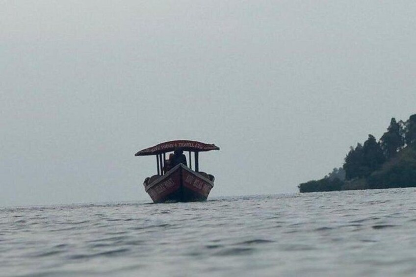 A boat with an umbrella on the water. 5