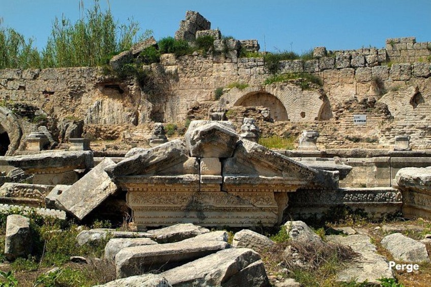 Ancient ruins with stone structures and arches. 1