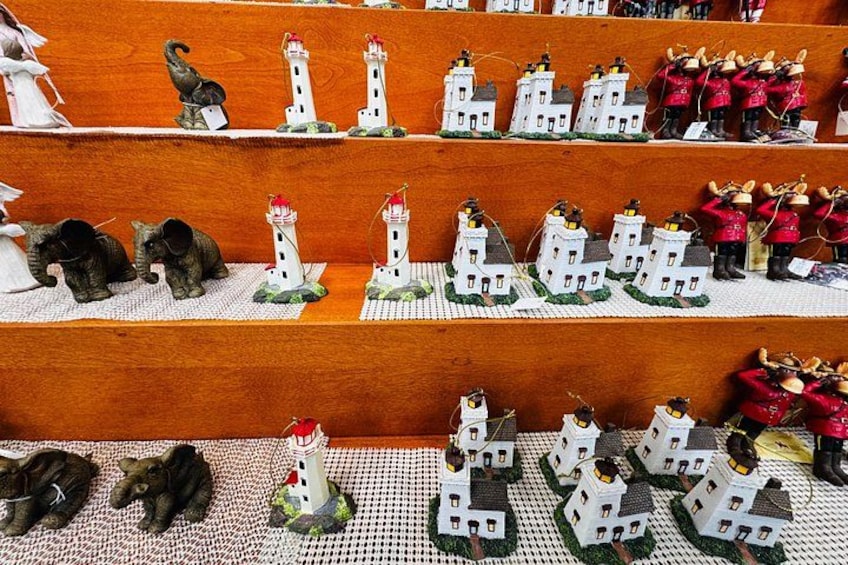 Miniature models of lighthouses, elephants, and soldiers on shelves. 5