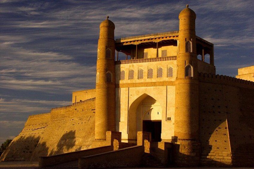 A historic fort with two prominent towers and a large entrance gate. 1