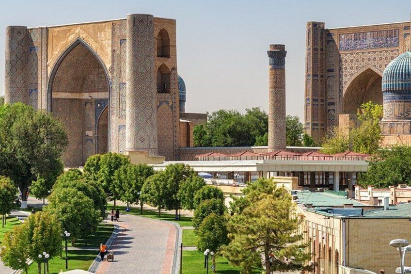 A historic building with intricate tile work, a dome, and tall minarets. 5