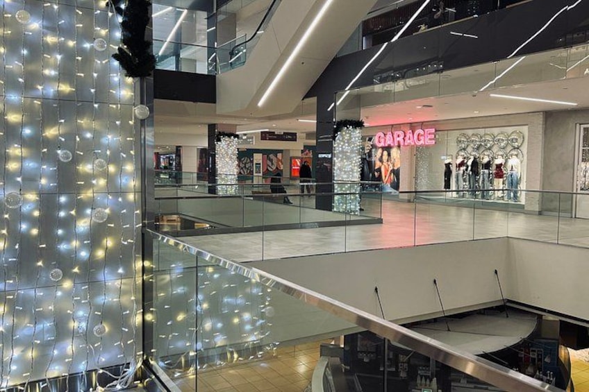 A multi-level shopping mall with a 'GARAGE' store on the second floor. 5