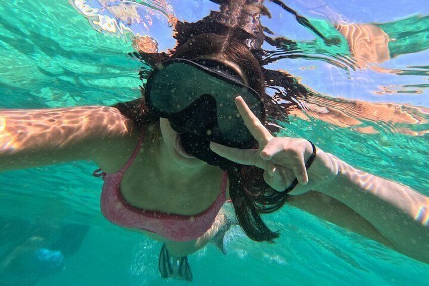 A person snorkeling underwater. 2