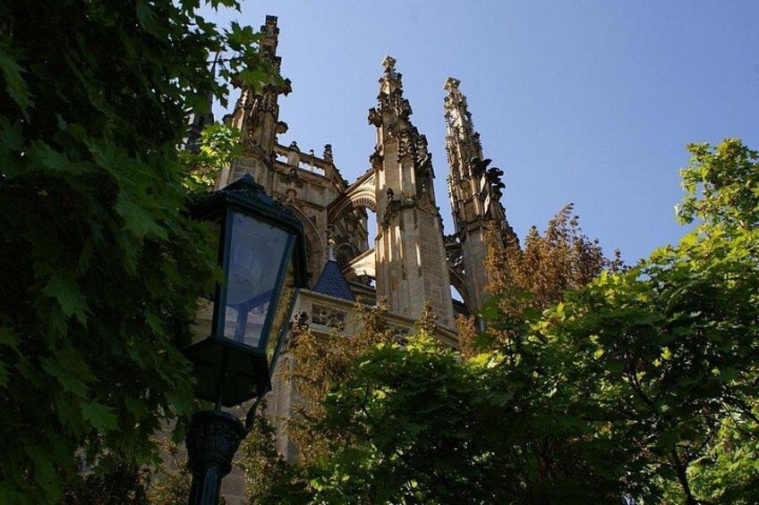 A Gothic-style church with intricate stonework and a prominent spire. 2
