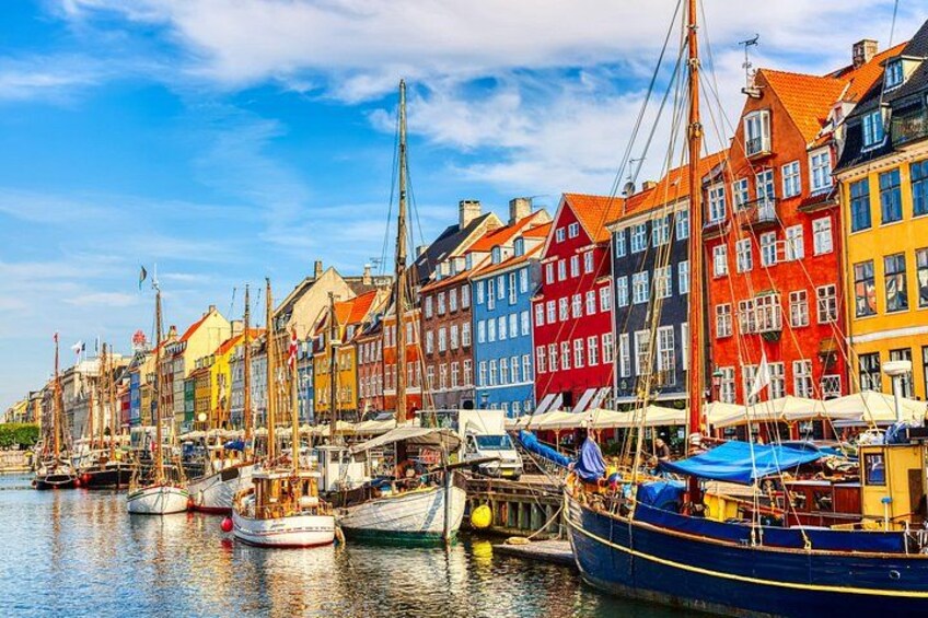 A harbor with colorful buildings and boats. 3