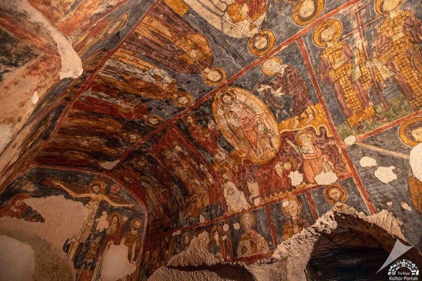 A detailed mosaic with religious figures and architectural elements. 4