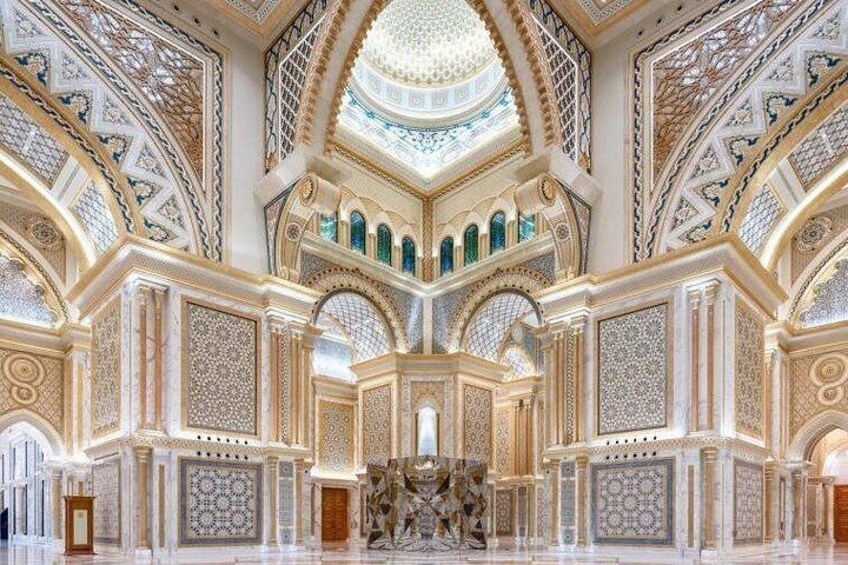 An ornate interior with intricate tile work, domed ceilings, and arched doorways. 2