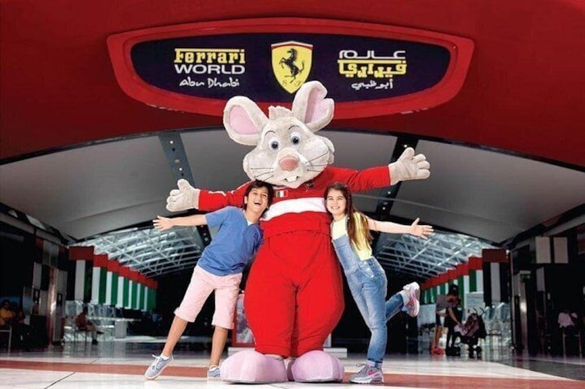 A mascot with a rabbit head, a red suit, and a Ferrari logo in the background. 3