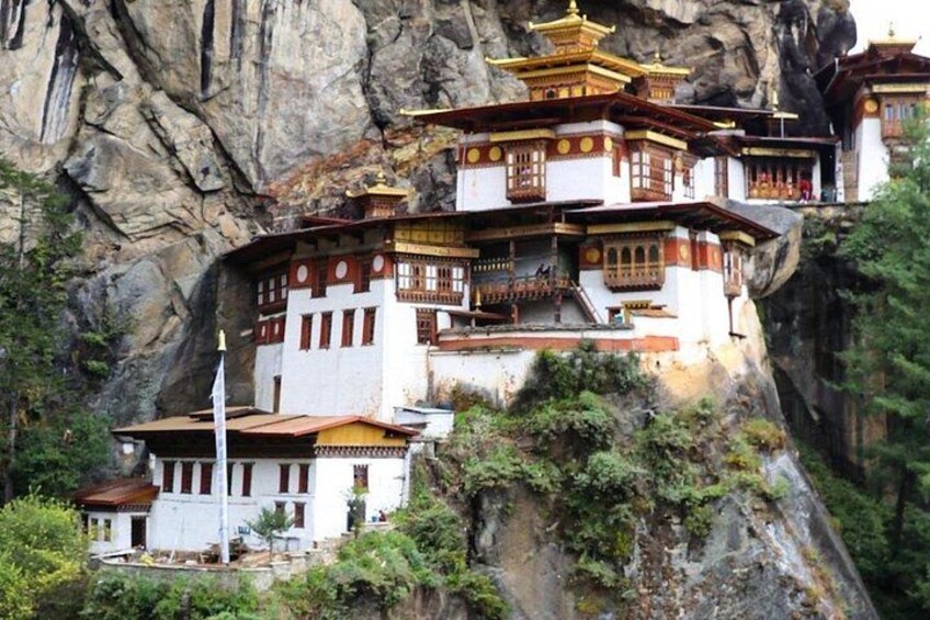 A multi-tiered temple complex perched on a cliff. 4