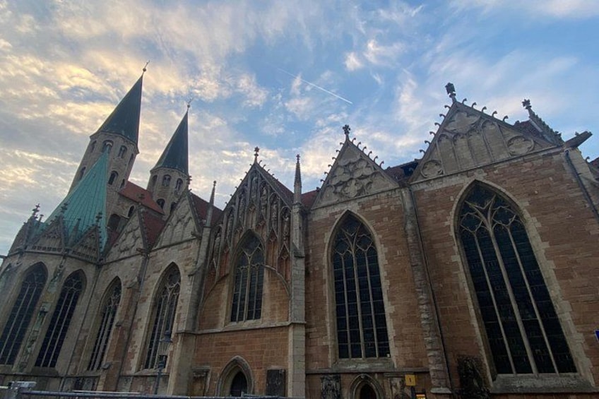 A historic church with pointed spires and large arched windows. 3