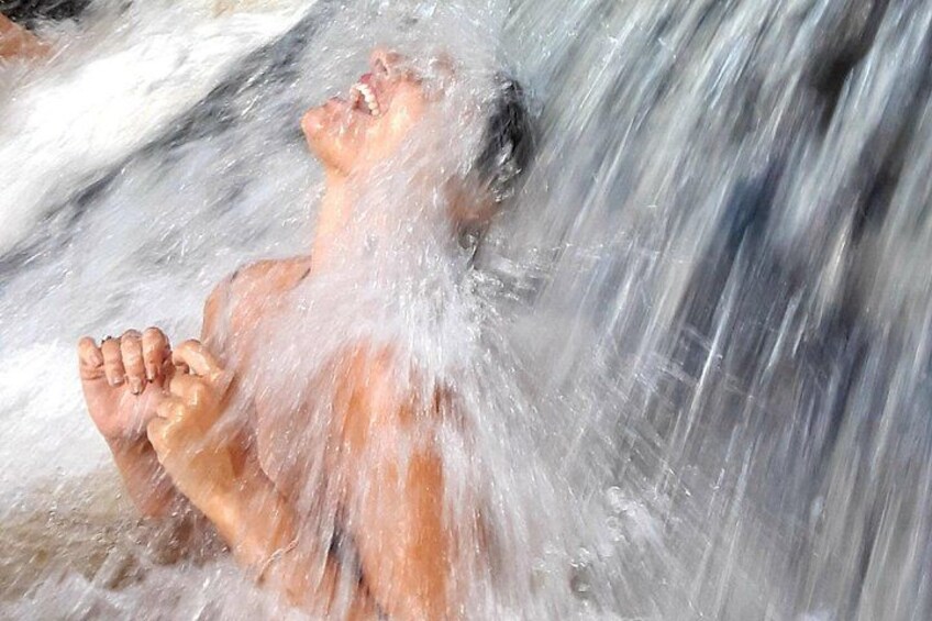 A person submerged in water, likely in a natural water body. 2