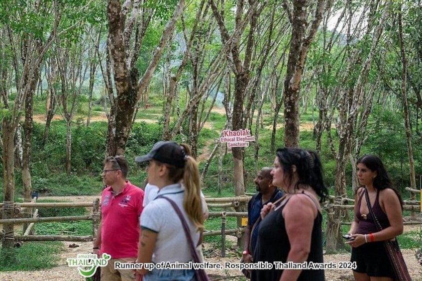 A group of people standing near a sign that reads 'Khaolak Ethical Wildlife Sanctuary.' 2