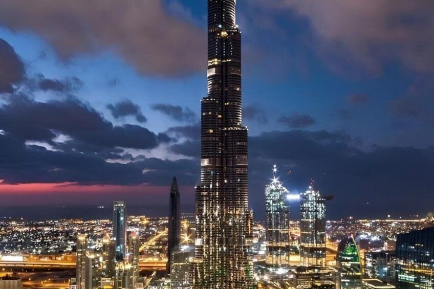 A cityscape at night with a prominent skyscraper. 3