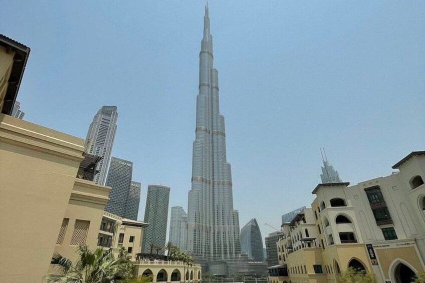 The Burj Khalifa, a tall skyscraper, surrounded by other buildings in a cityscape. 5