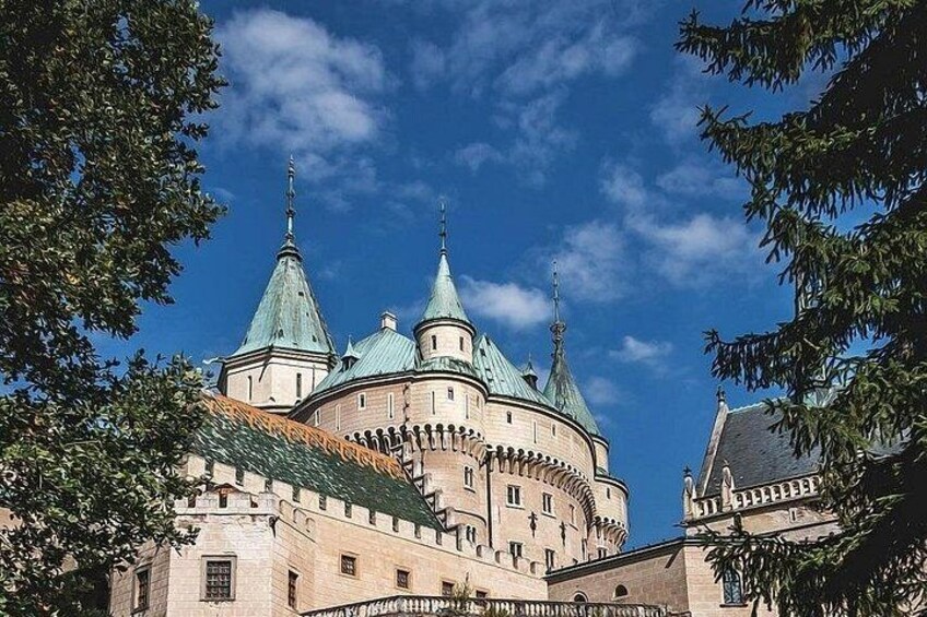 A historic building with multiple domes and a prominent entrance. 2