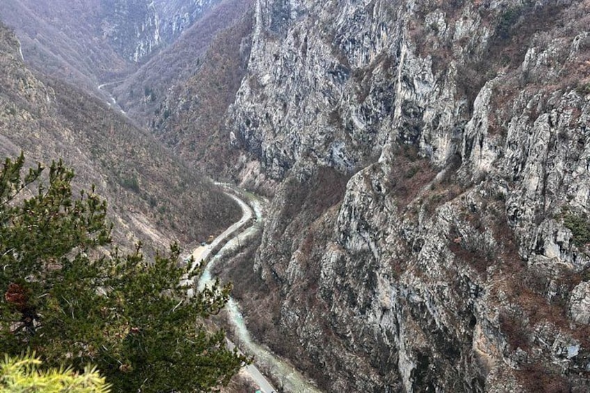 A rugged mountain landscape with a winding road. 4