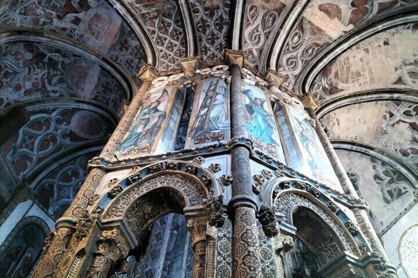 An ornate cathedral interior with intricate stone carvings and detailed frescoes on the ceiling. 4