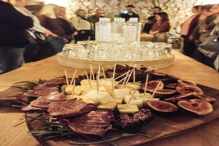 A charcuterie board with various meats, cheeses, and figs. 2