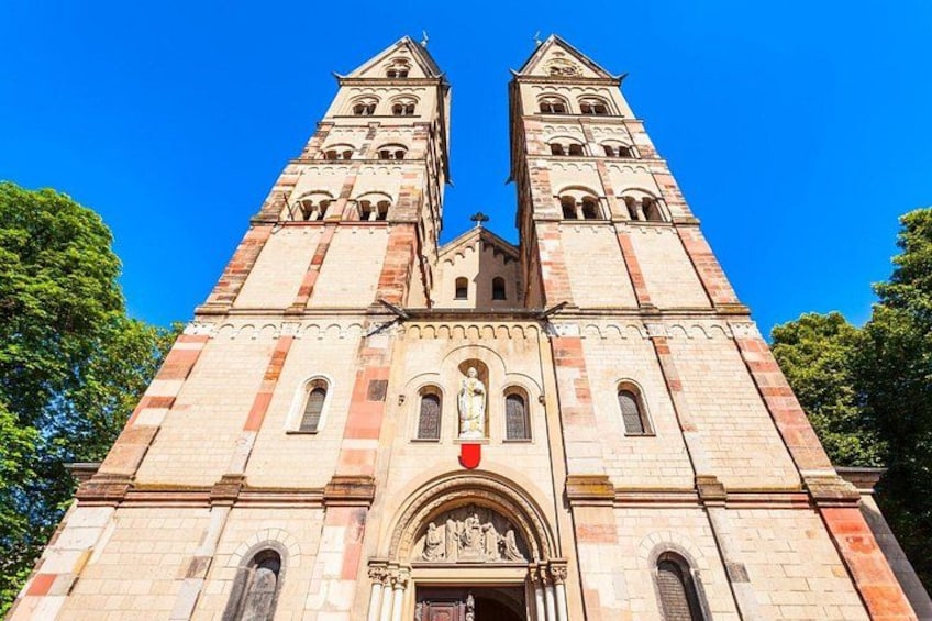 A large, historic church with two tall towers and a central entrance. 2