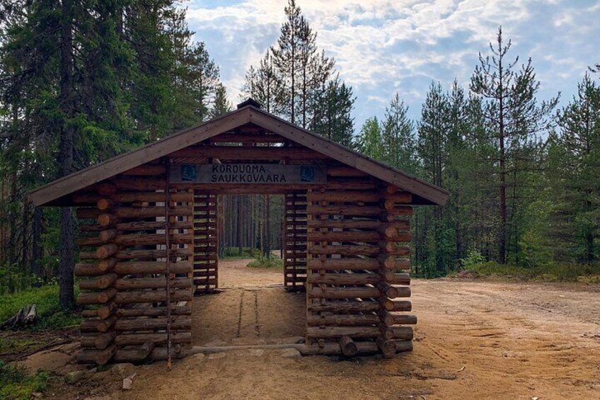 A rustic wooden cabin named 'Korovuoma SaukkoVaar' in a forested area. 3