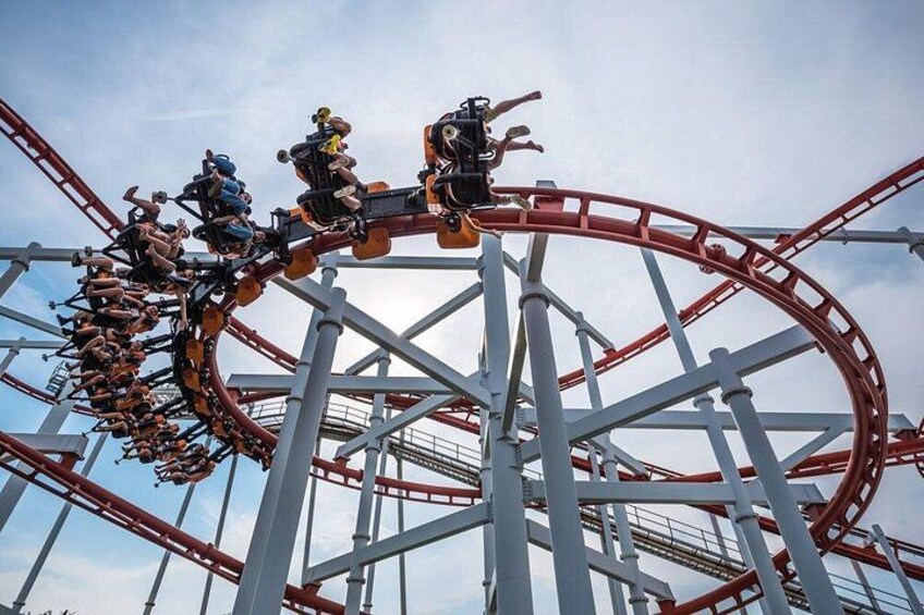 eople playing the Roller Coaster Track on background of blue sky and white cloud at Dream World amusement park in bangkok ,Thailand. 4
