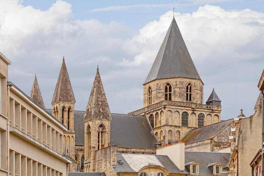 A historic building with multiple pointed towers and a large central tower. 1
