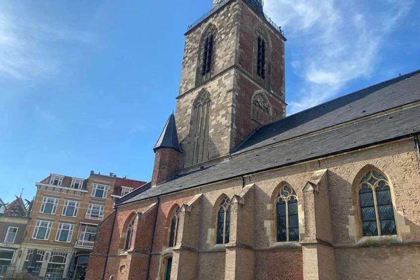 A church with a prominent tower and arched windows. 3