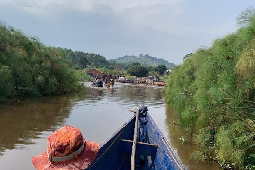 A river with boats and a hat on the shore. 3
