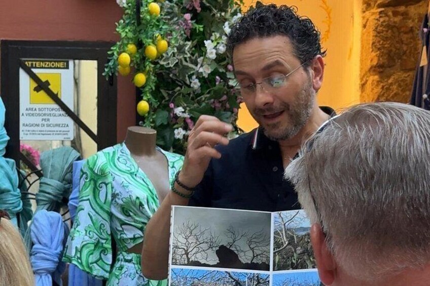 A person presenting a book to an audience. 2