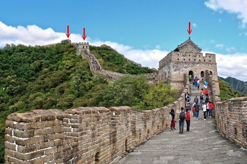 The Great Wall of China with tourists walking along the path. 1