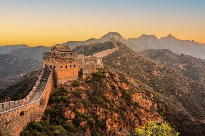 The Great Wall of China, a historic fortification, winding through mountainous terrain. 5