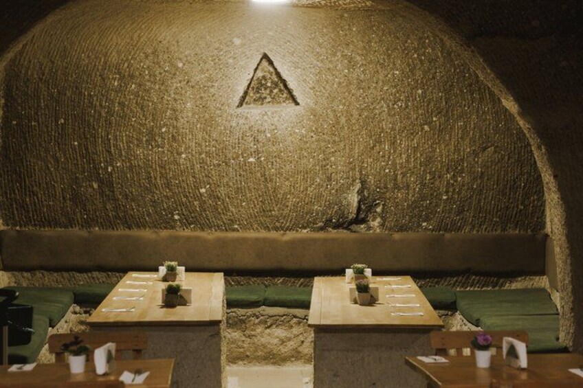 An underground shooting range with targets and seating. 2