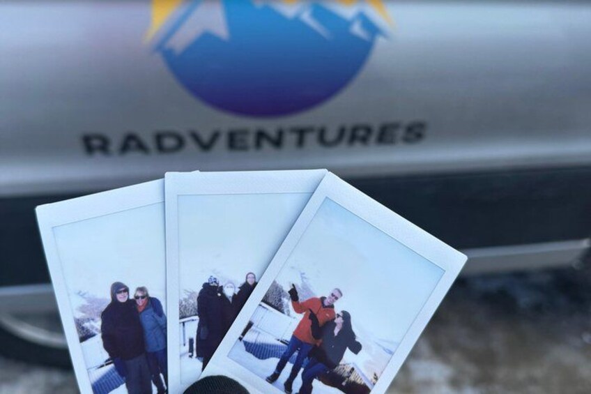 A vehicle with the text 'RADVENTURES' and a logo with a mountain and sun. 4