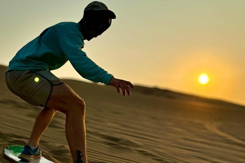 A person surfing on a wave at sunset. 5