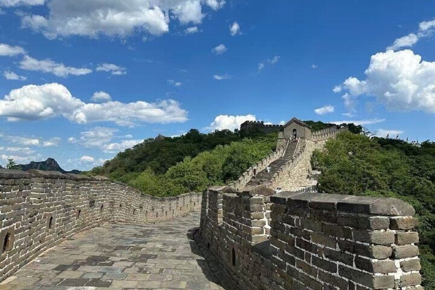 The Great Wall of China with stone steps leading up to a watchtower. 5