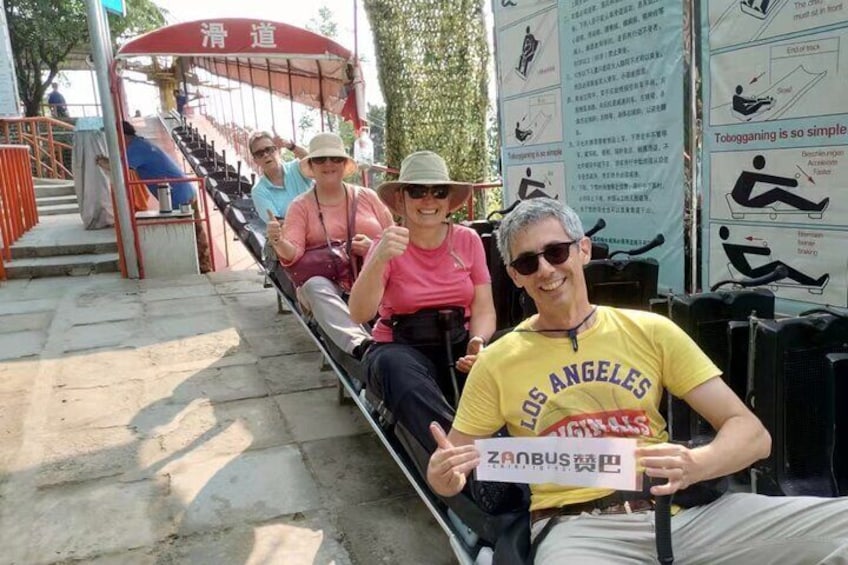 People sitting on a bench at a park. 4