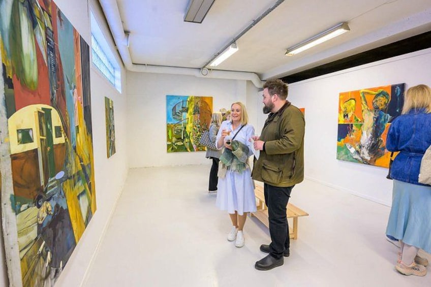 An art gallery with abstract paintings on the walls. 3